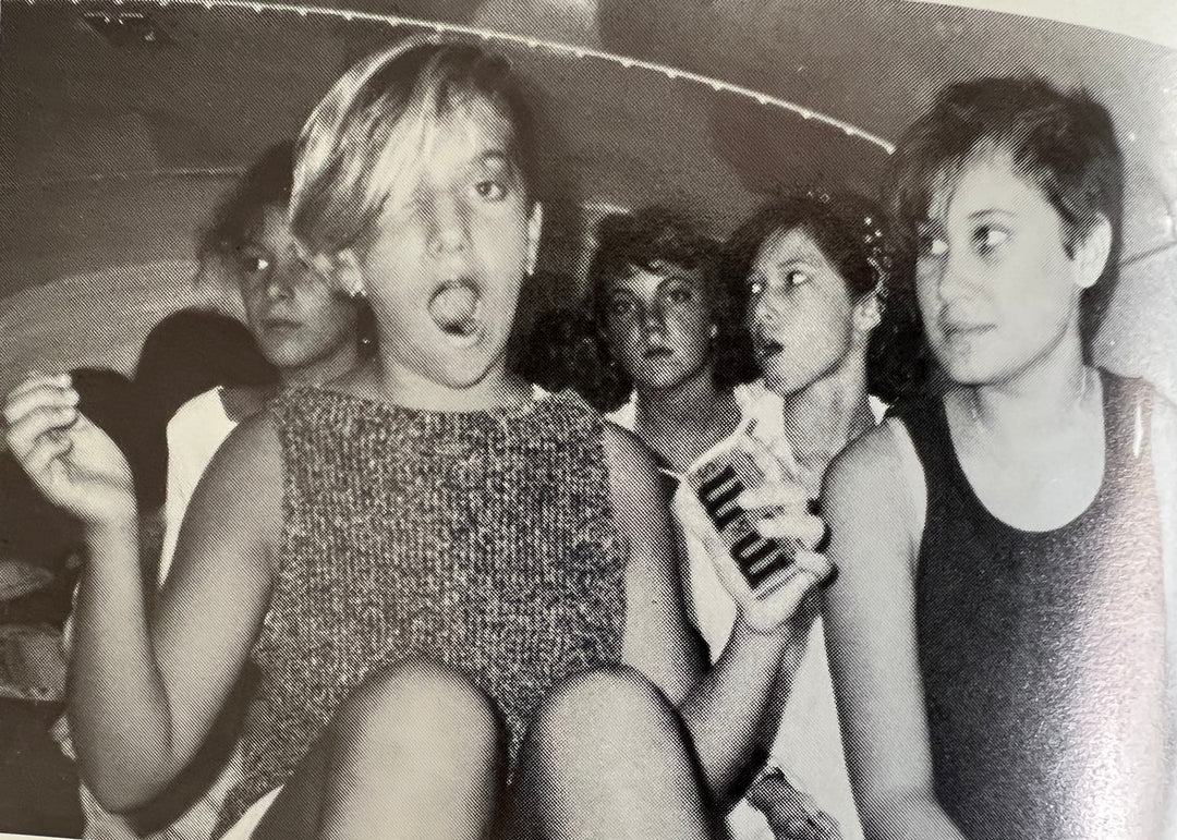 Elli Milan as a teenager in a car with friends