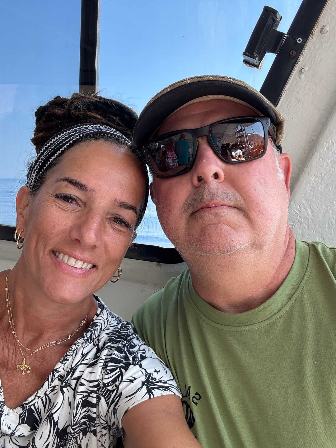 Elli and John ride the ferry to their favorite spot in Greece