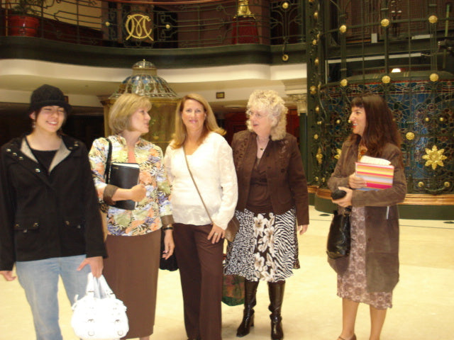 Five women standing together in an ornate hotel lobby in Mexico City in 2007