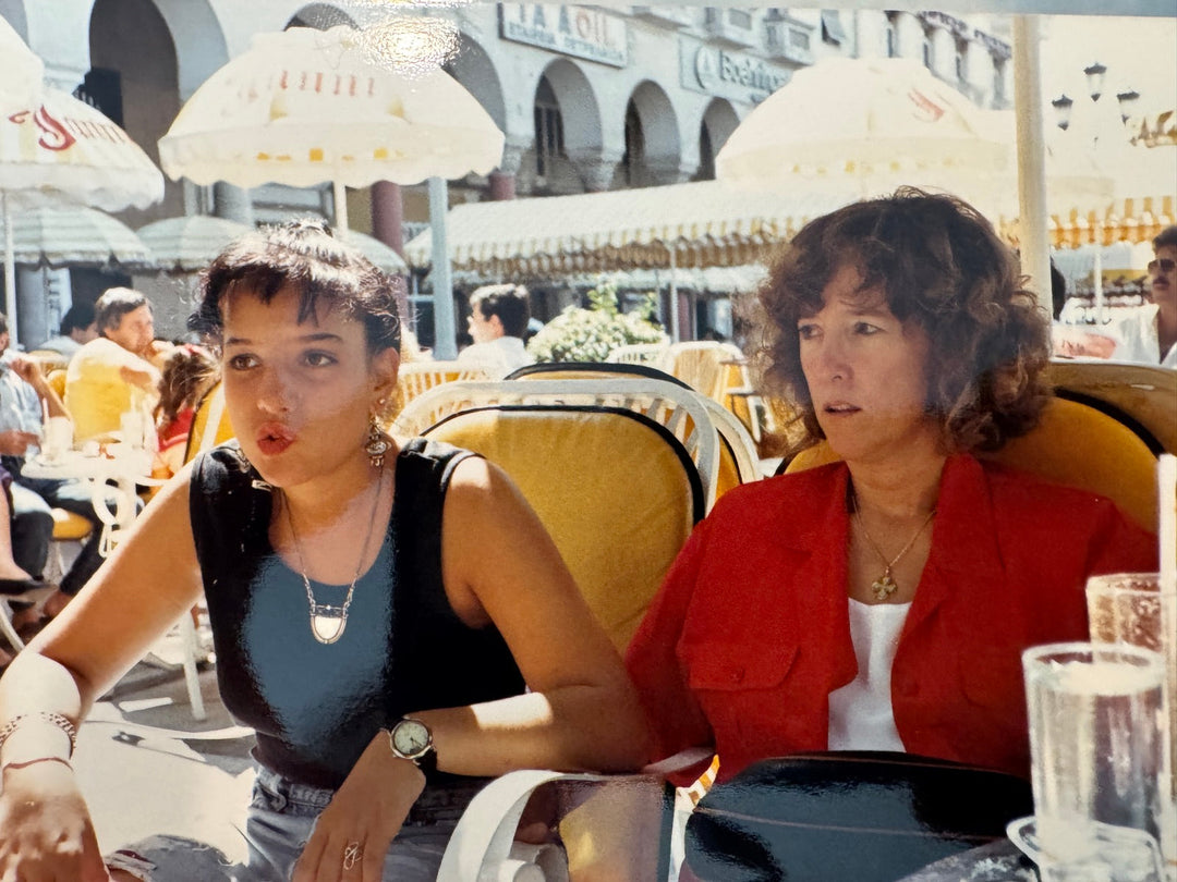Elli Milan as a young woman at an outdoor café in Europe